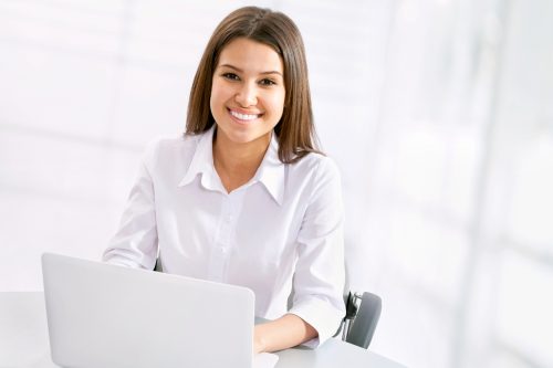 Invisalign being used by busy professional with smile